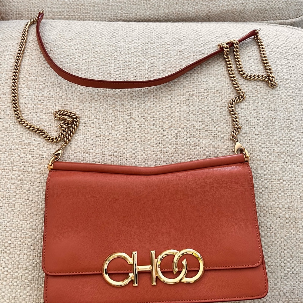 Jimmy Choo, 8 x 5 1/2 x 2 Crossbody bag and a dusty rose color